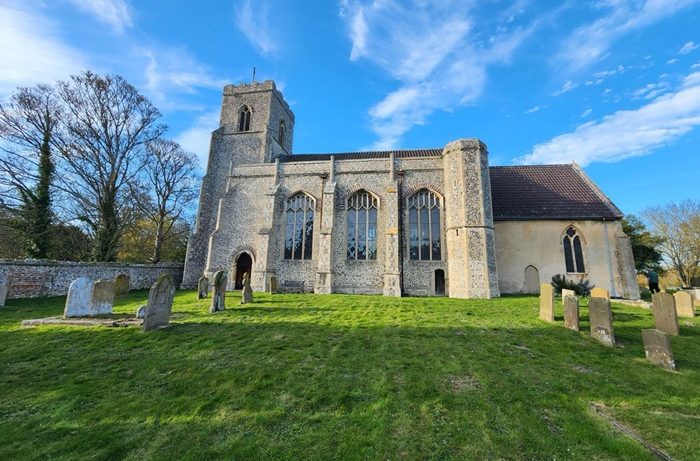 The Church of St John and St Mary and historic churchyard in Stiffkey, North Norfolk, with medieval flint architecture.