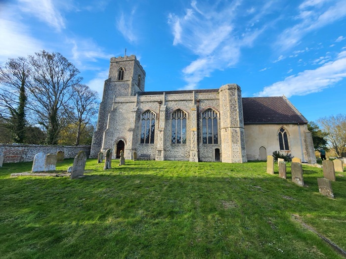 The Church of St John and St Mary and historic churchyard in Stiffkey, North Norfolk, with medieval flint architecture.